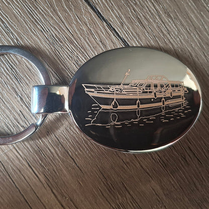 Chrome plated oval keyring engraved with our Stevens 1140 Canal Yacht Artwork