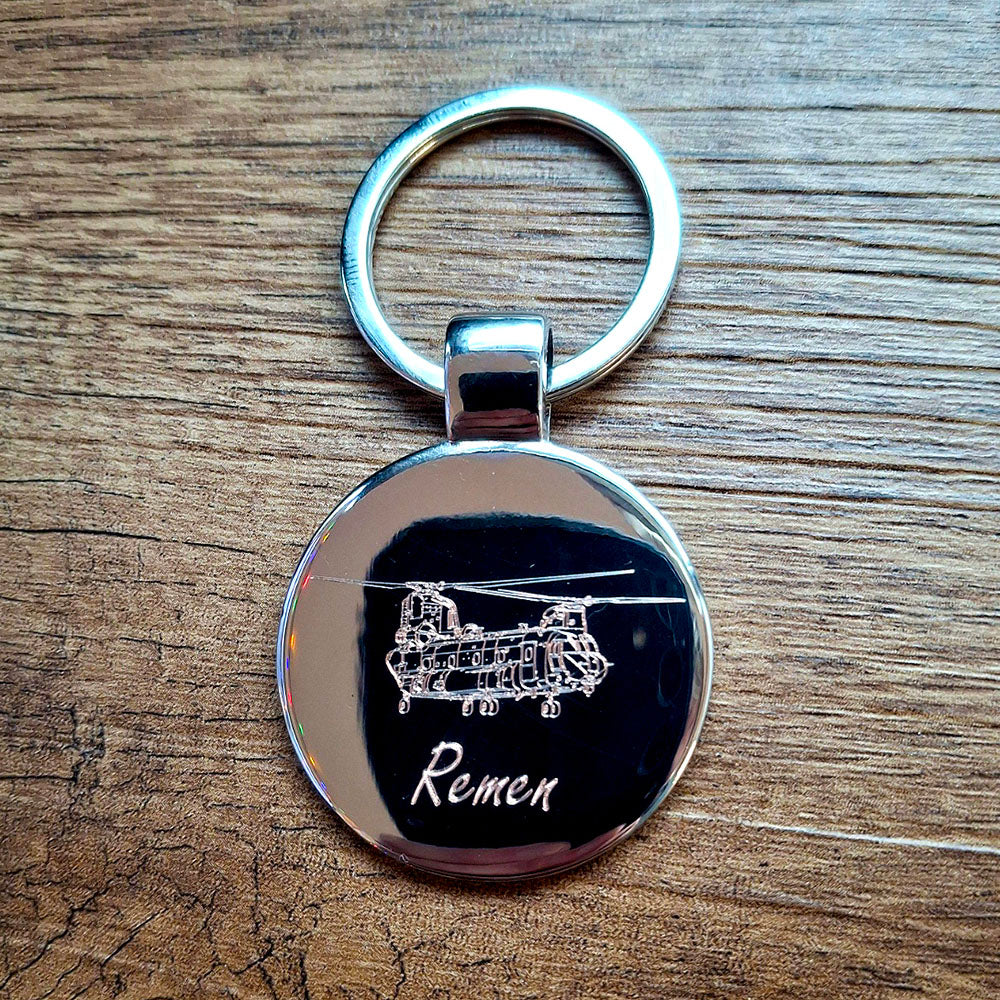 Personalised round keyring with chinook helicopter artwork.