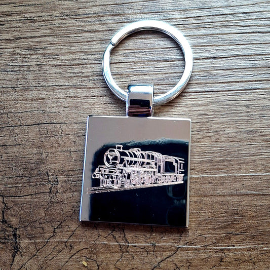 Steam train locomotive engraved on a square keyring