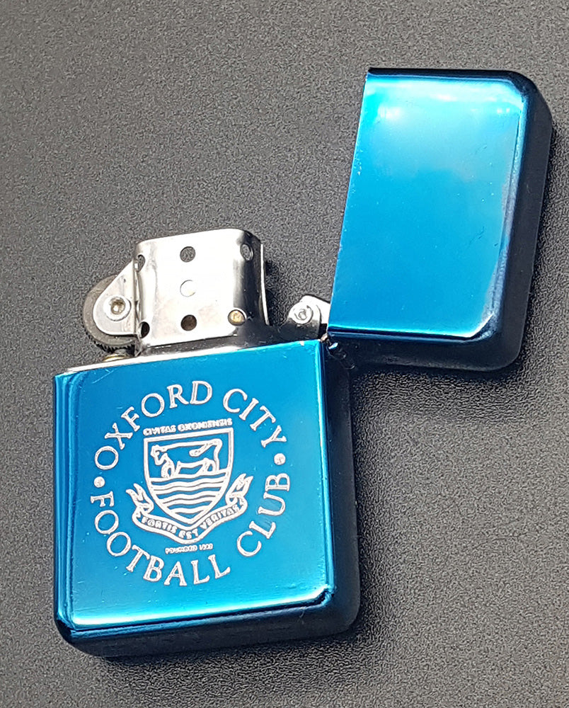 Blue lighter with Oxford City Football Club logo on a gray background