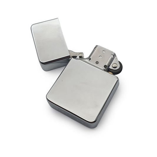 Silver Chrome petrol lighter with open lid on a white background