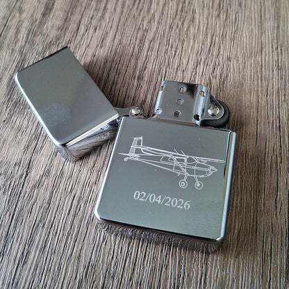 Silver chrome lighter engraved with our Cessna 180 artwork and a date.