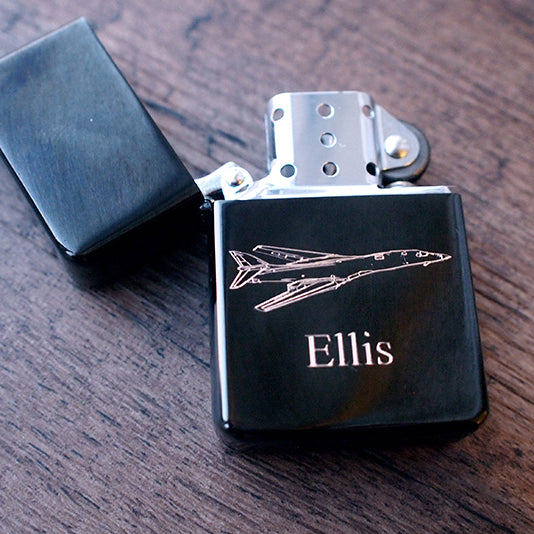 Black flip top lighter engraved with Rockwell B1 Lancer aircraft artwork.