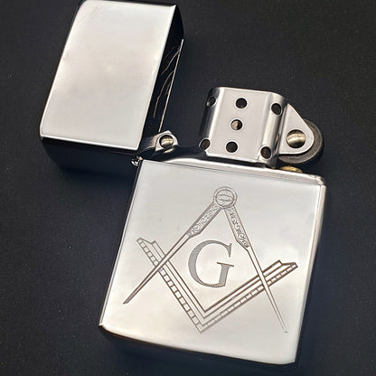 Masonic G regalia artwork on a chrome silver lighter