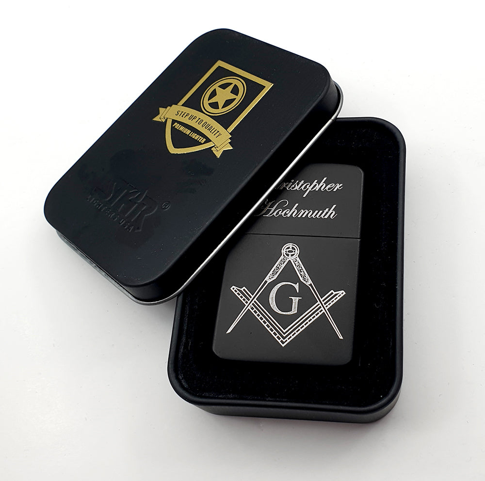 personalised Black lighter with Masonic design and 'G' symbol, placed inside a metal tin black case on a white background.
