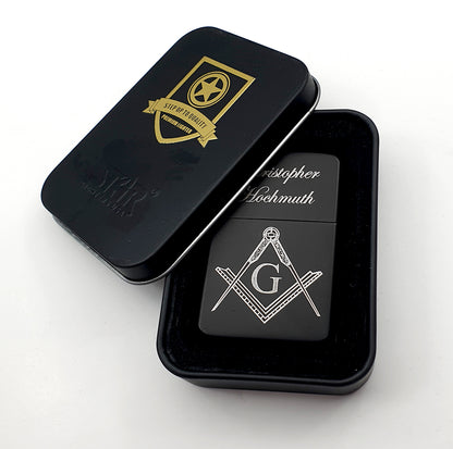 personalised Black lighter with Masonic design and 'G' symbol, placed inside a metal tin black case on a white background.