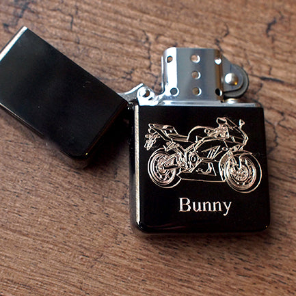 Fireblade motorcycle engraved on open black petrol lighter with 'bunny' engraved underneath
