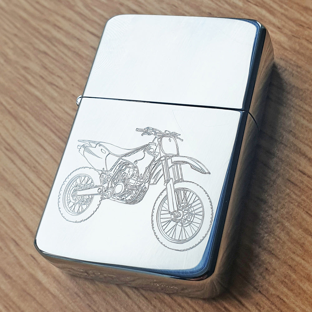 silver lighter with a motocross motorcycle engraving