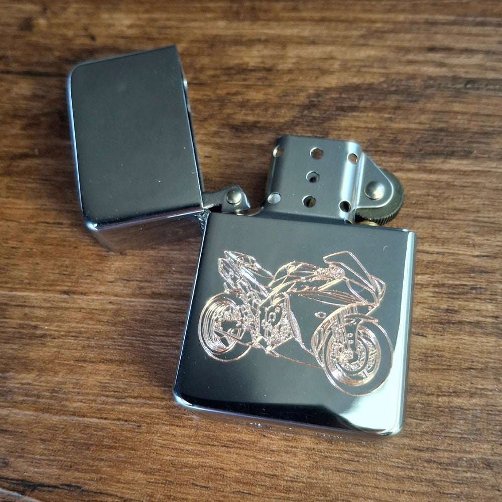 R1 Motorcycle etched into an open chrome lighter