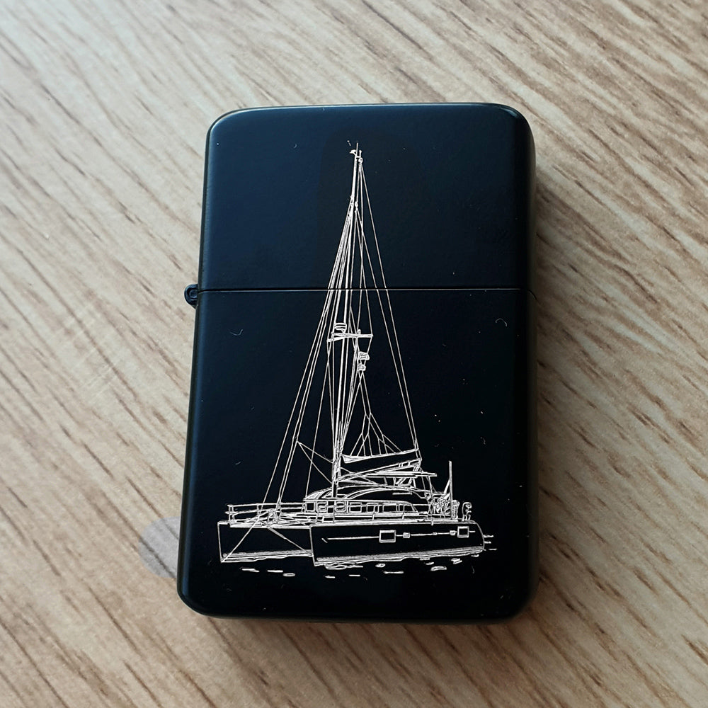Our Catamaran artwork engraved on a black lighter