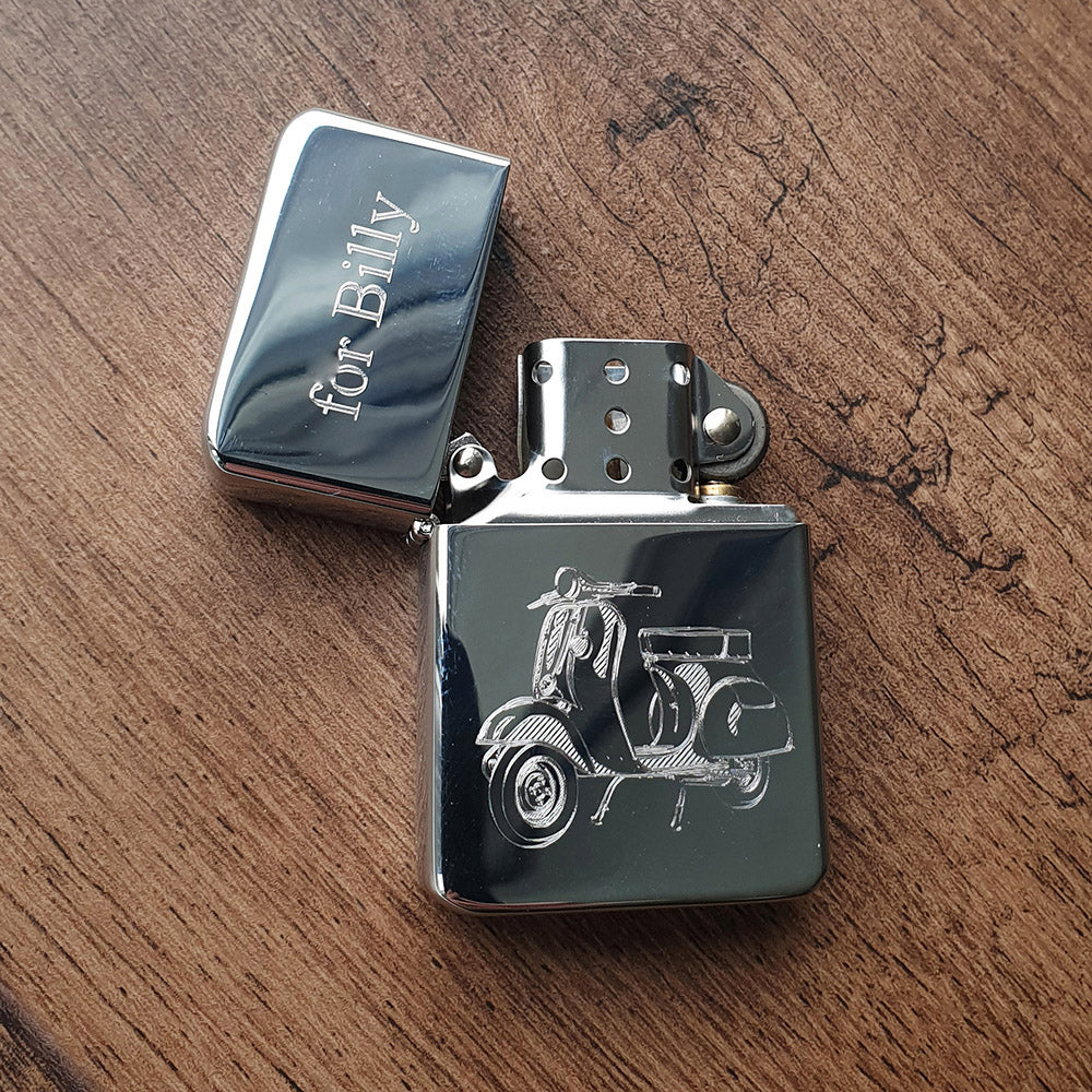 Vespa scooter etched into an open sliver lighter