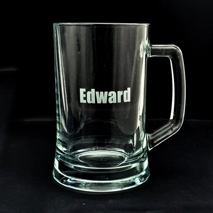 Clear glass mug with 'Edward' engraved on a black background