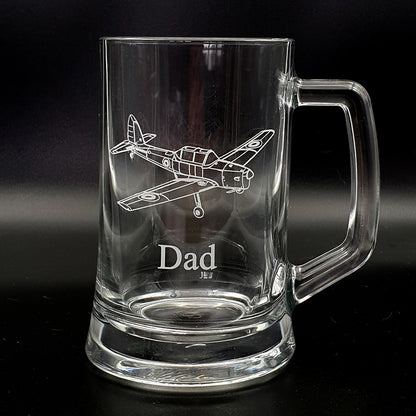 Clear glass mug with vintage chipmunk airplane engraving and 'Dad' text on a black background