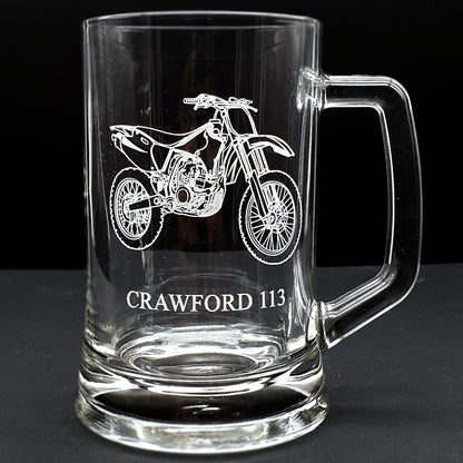 Clear glass mug with a our motocross dirt bike motorcycle engraving and text 'CRAWFORD 113' on a black background