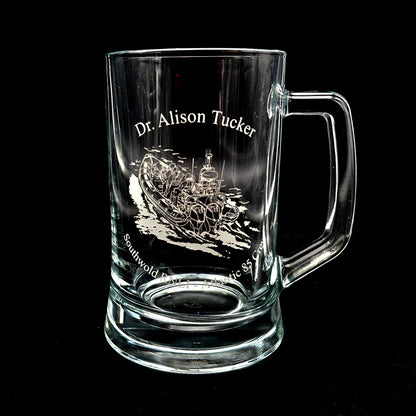 Inshore Lifeboat artwork engraved on a glass tankard with a name curved across the top and additional text at the bottom around the artwork.