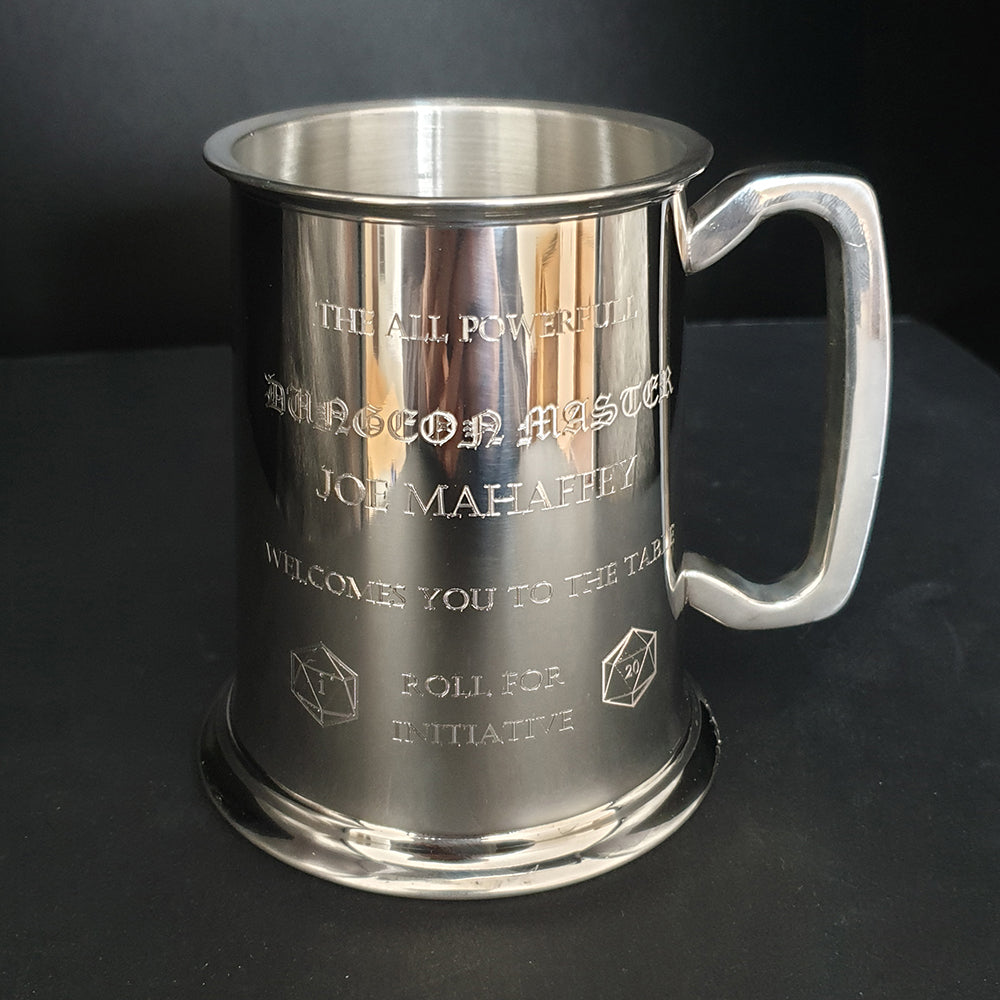 Pewter Tankard with table top gaming engraving against a dark backdrop