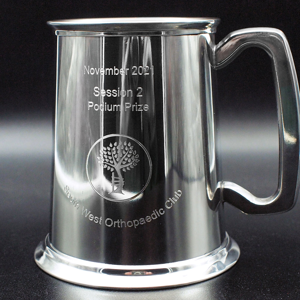 Silver pewter trophy tankard with logo and text engraved.