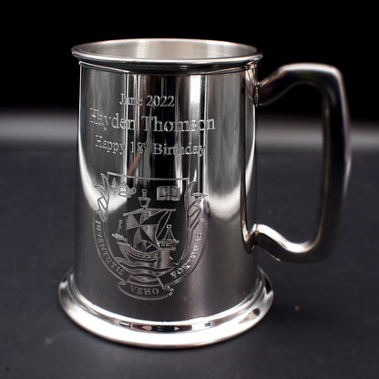 Pewter silver Birthday tankard with text and crest engraved against a black background