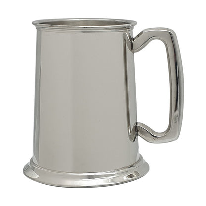 plain silver pewter tankard mug shown with handle on the right