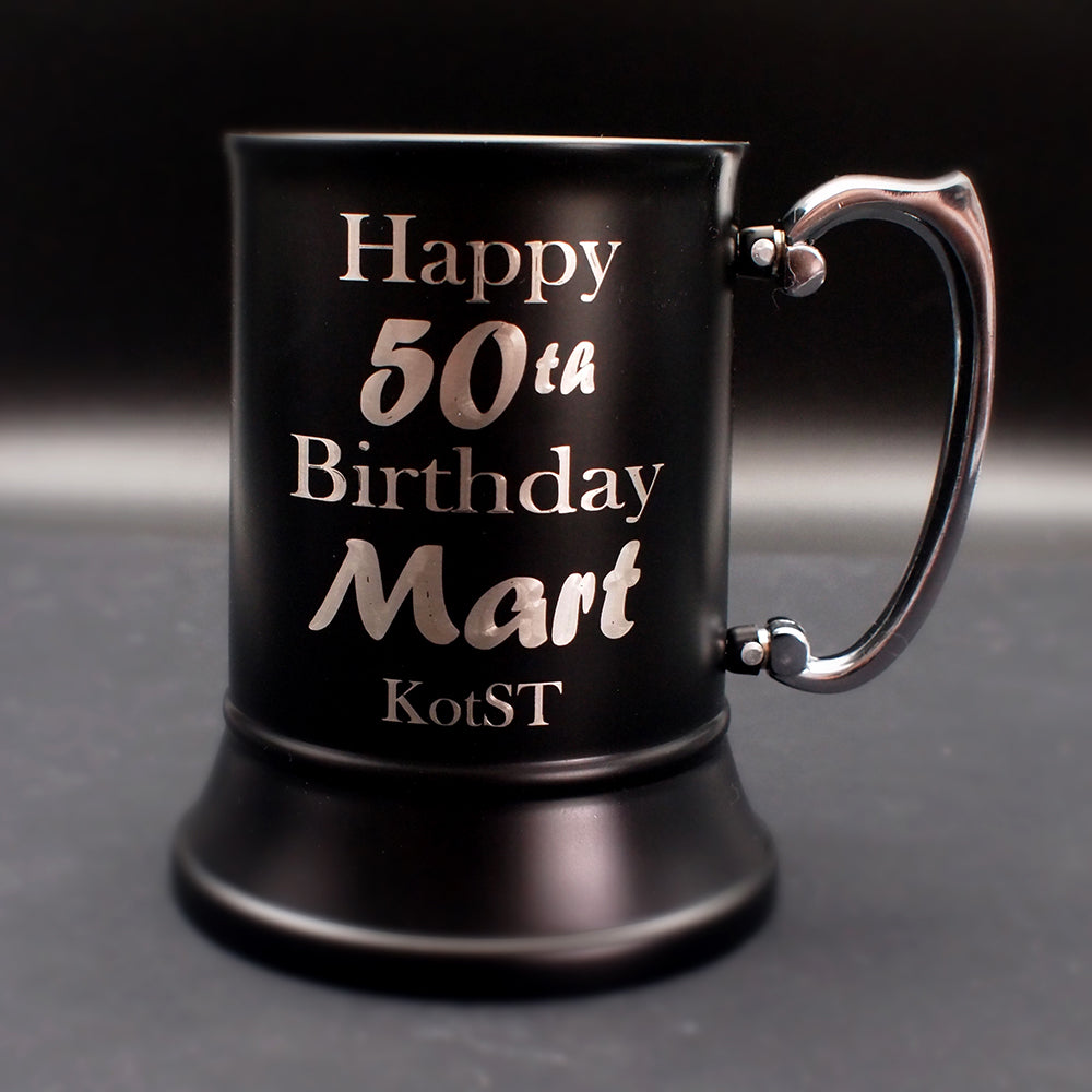 Steel Black mug with 'Happy 50th Birthday Mart' text on a dark background