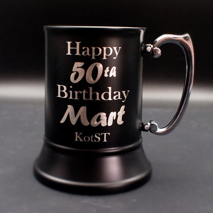 Steel Black mug with 'Happy 50th Birthday Mart' text on a dark background