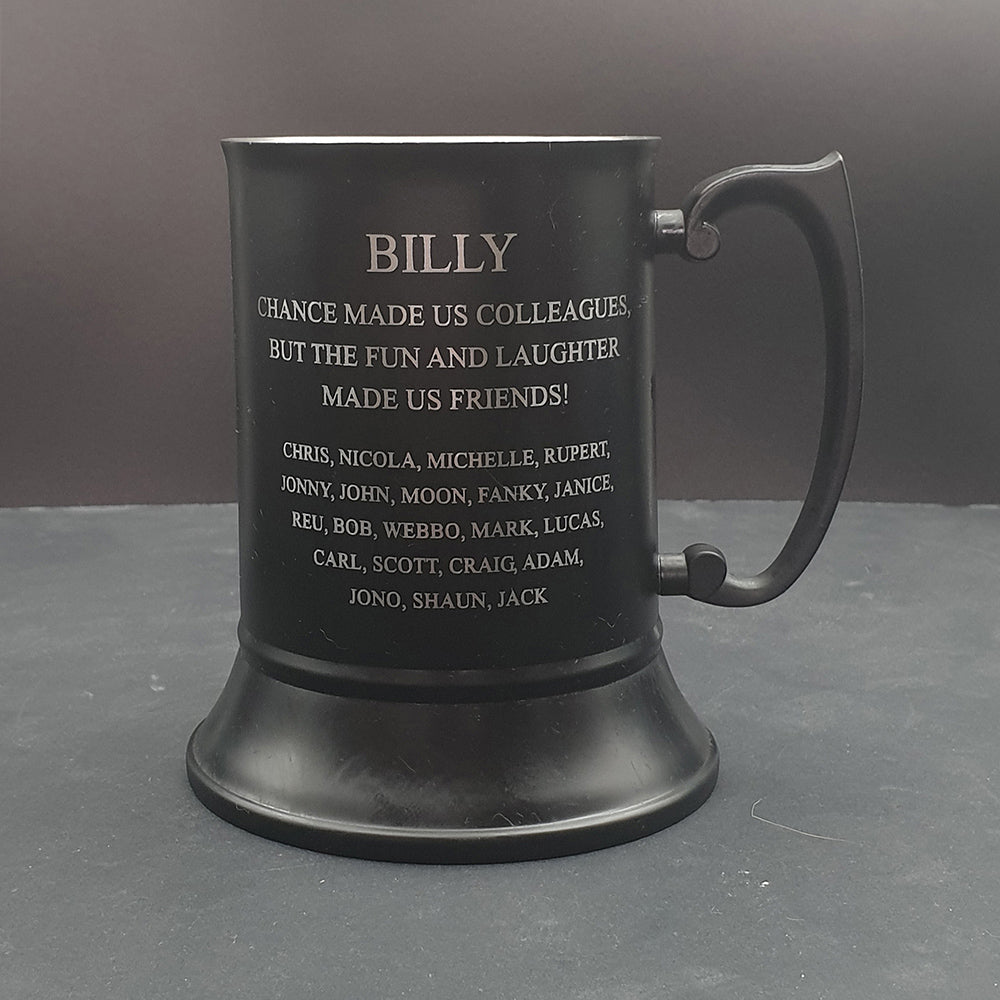 Steel Black tankard mug with engraved text on a Gray background