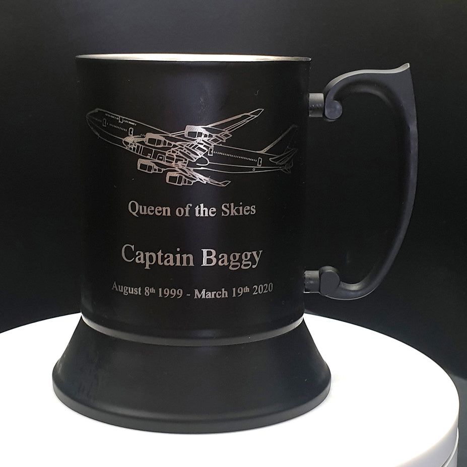 Black steel mug with Boeing 747 Aircraft engraving and text on a dark background
