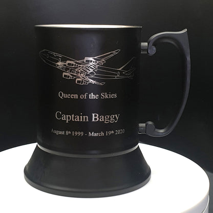 Black steel mug with Boeing 747 Aircraft engraving and text on a dark background