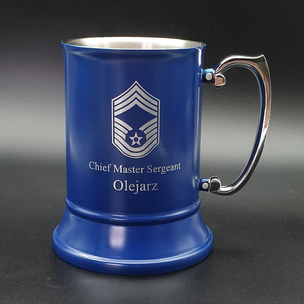 Blue mug with silver handle and Chief Master sergeant emblem on a dark background