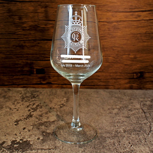 Metropolitan Police logo with retirement text on an everyday wine glass.