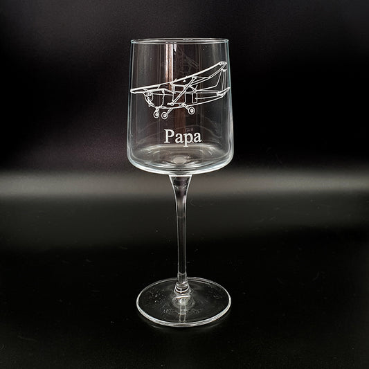 Wine glass with Cessna 172 airplane design and 'Papa' text on a black background