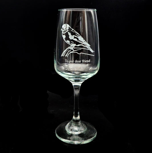 golden fitch bird artwork engraved with a personal message on an everyday wine glass