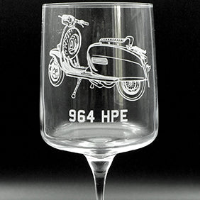 Lambretta artwork engraving with license plate style number below on a wine glass.
