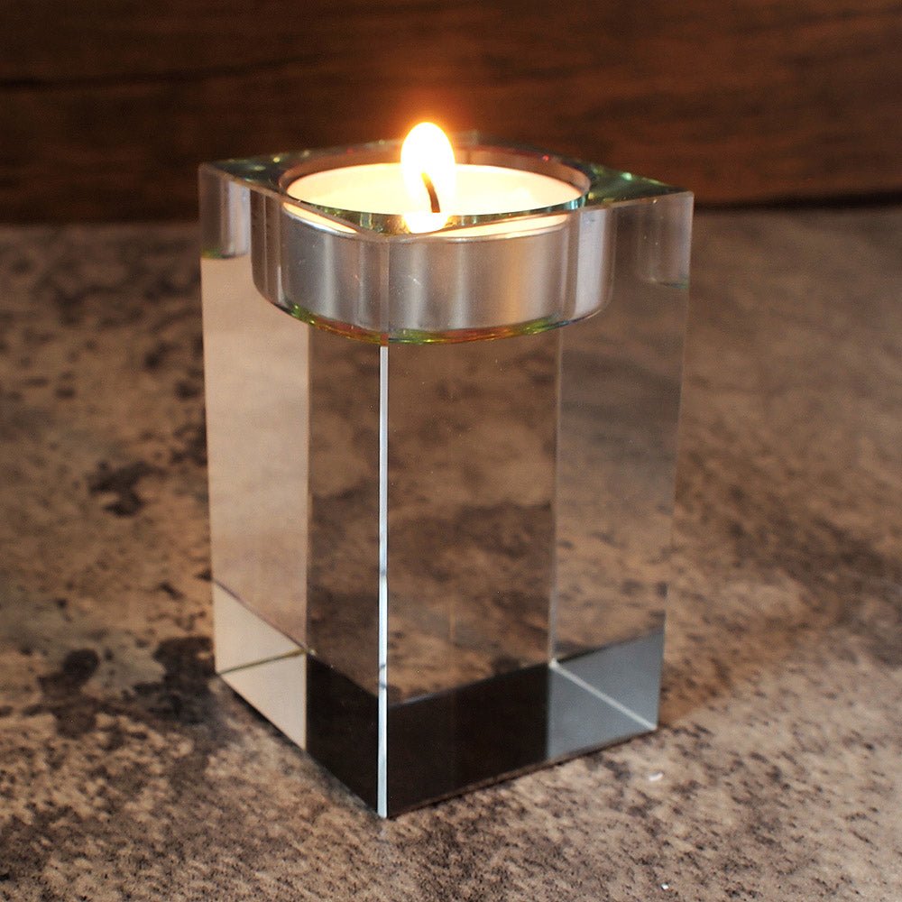 low angle image of optic glass tealight holder with candle