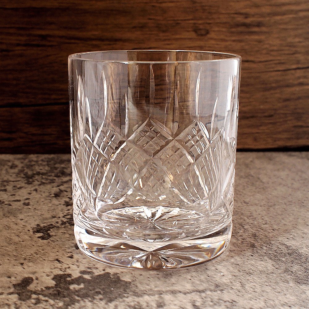 Solitaire glass tumbler with hand cut detailing