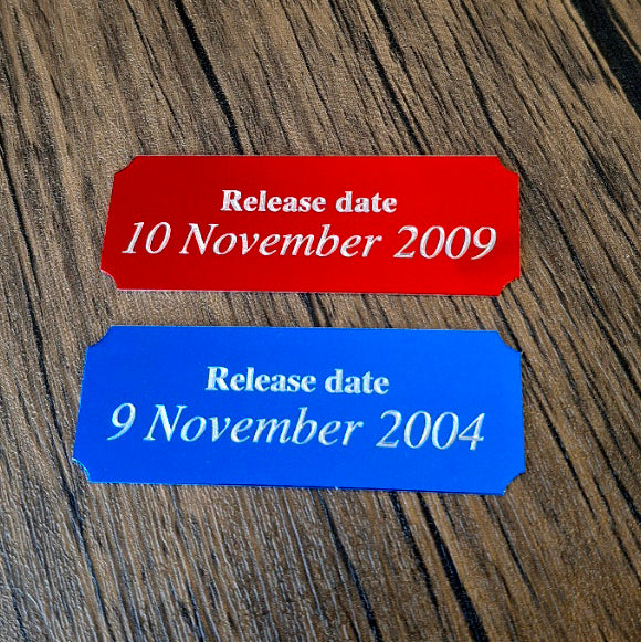Black and Red Plaques engraved with release dates for video games