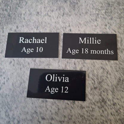 set of 3 black straight corner plaques engraved with baby names and ages