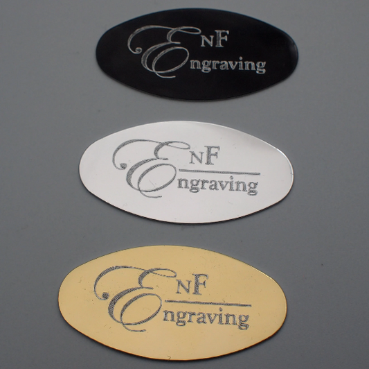 Gold, Silver, Black oval plaques engraved with EnF Engraving on each.