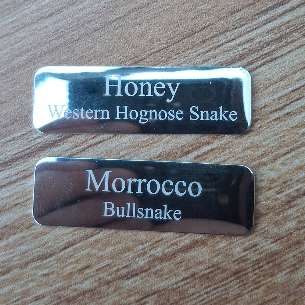 small Silver rounded corner plaques engraved with text
