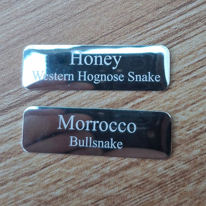 small Silver rounded corner plaques engraved with text